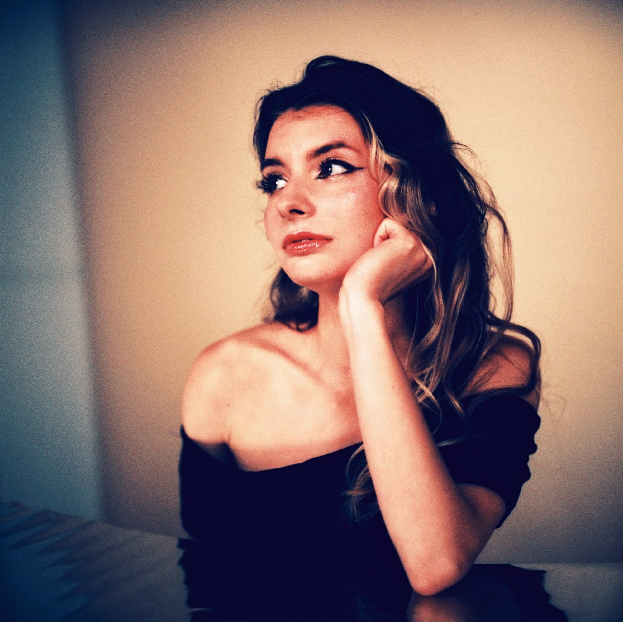 Dreamy colorful studio portrait of beautiful woman on Harman Phoenix I 200 medium format film.